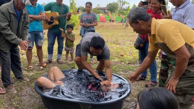 Sophiep being baptized